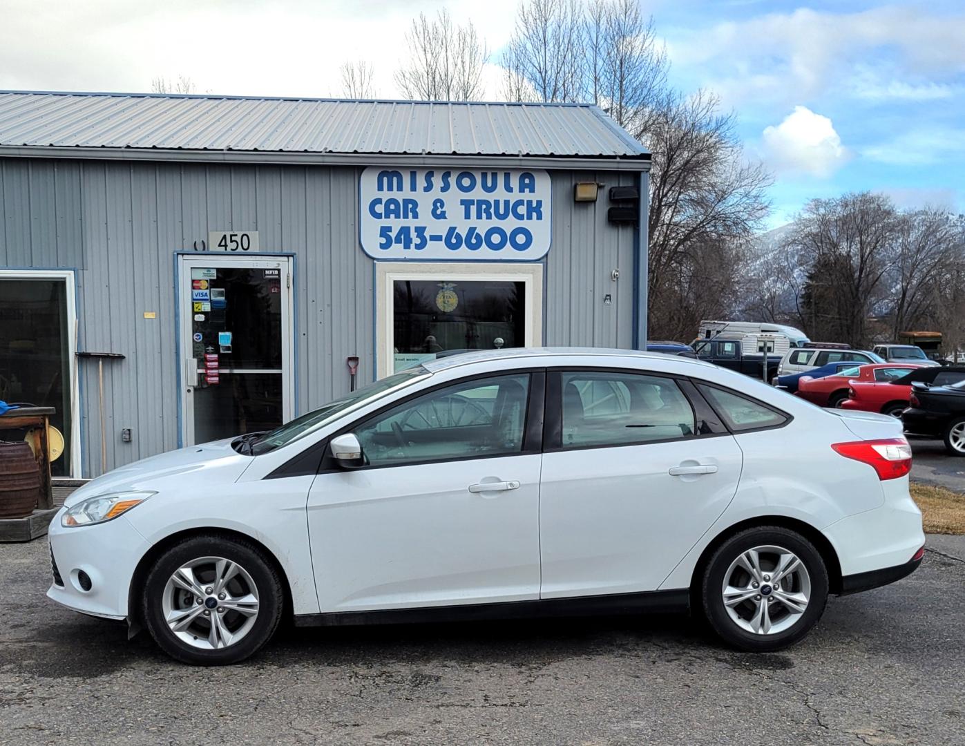 2013 White /Black Ford Focus SE (1FADP3F23DL) with an 2.0L I4 engine, 6 Speed Automatic transmission, located at 450 N Russell, Missoula, MT, 59801, (406) 543-6600, 46.874496, -114.017433 - Great Little Sedan. Excellent Fuel Economy. Only 69K Miles! Heated Seats. Air Cruise Tilt. Power Windows and Locks. AM FM CD XM Bluetooth. - Photo#0